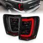 ANZO 1999-2004 Jeep Grand Cherokee LED Tail Lights w/ Light Bar Black Housing Smoke Lens